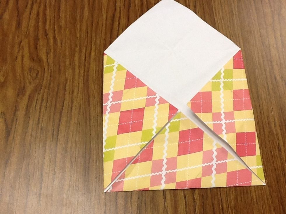 Then grab that corner and fold it to the middle.