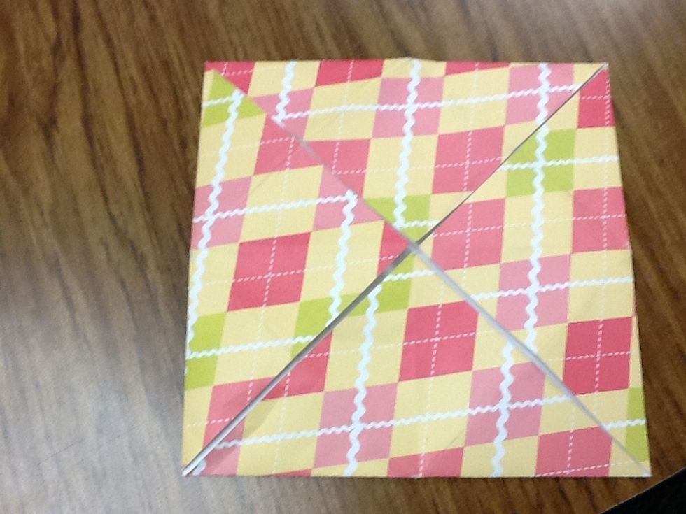 Then grab that corner and fold it to the middle.