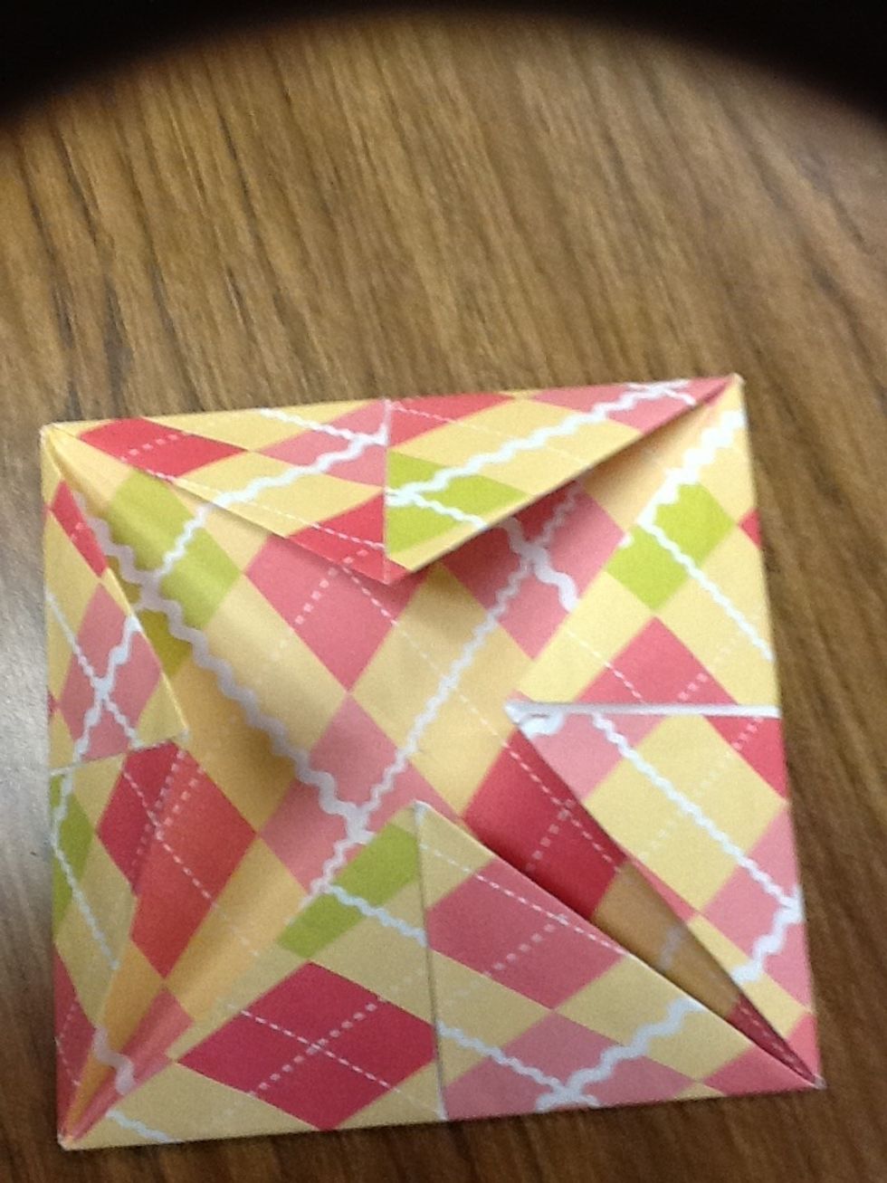 Then grab the last corner and fold it to the middle.