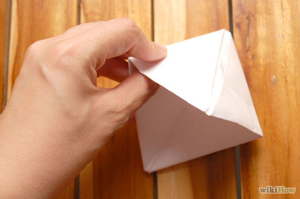 Then grab the top and pull the two top sides then you will see your boat.