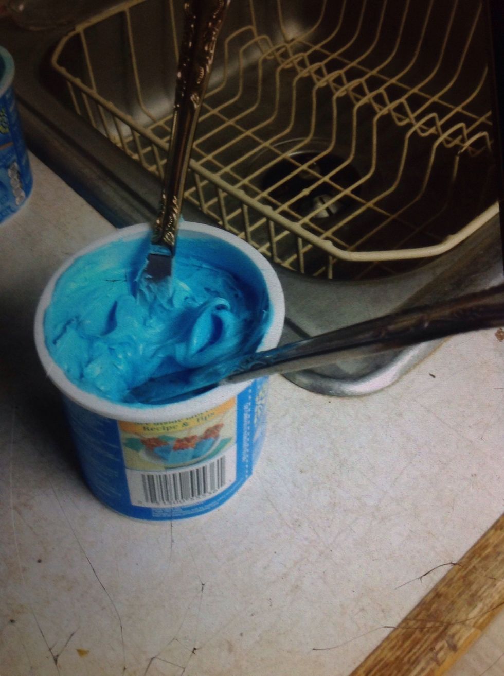 Then, grab your butter knife and frosting. After that, start frosting your cookies you don't have to this is optional.