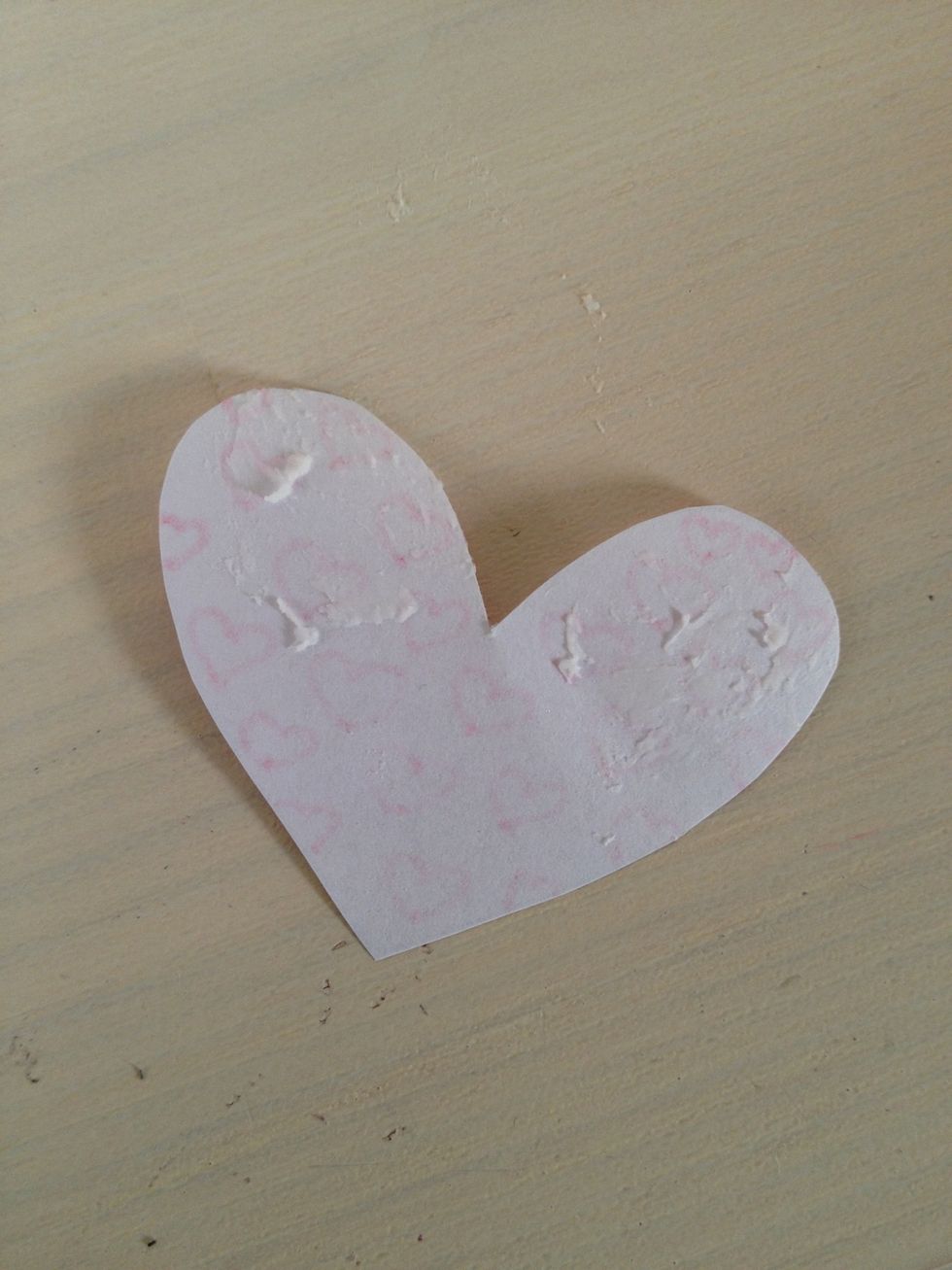 Then grab your glue and glue the back top half of your heart.