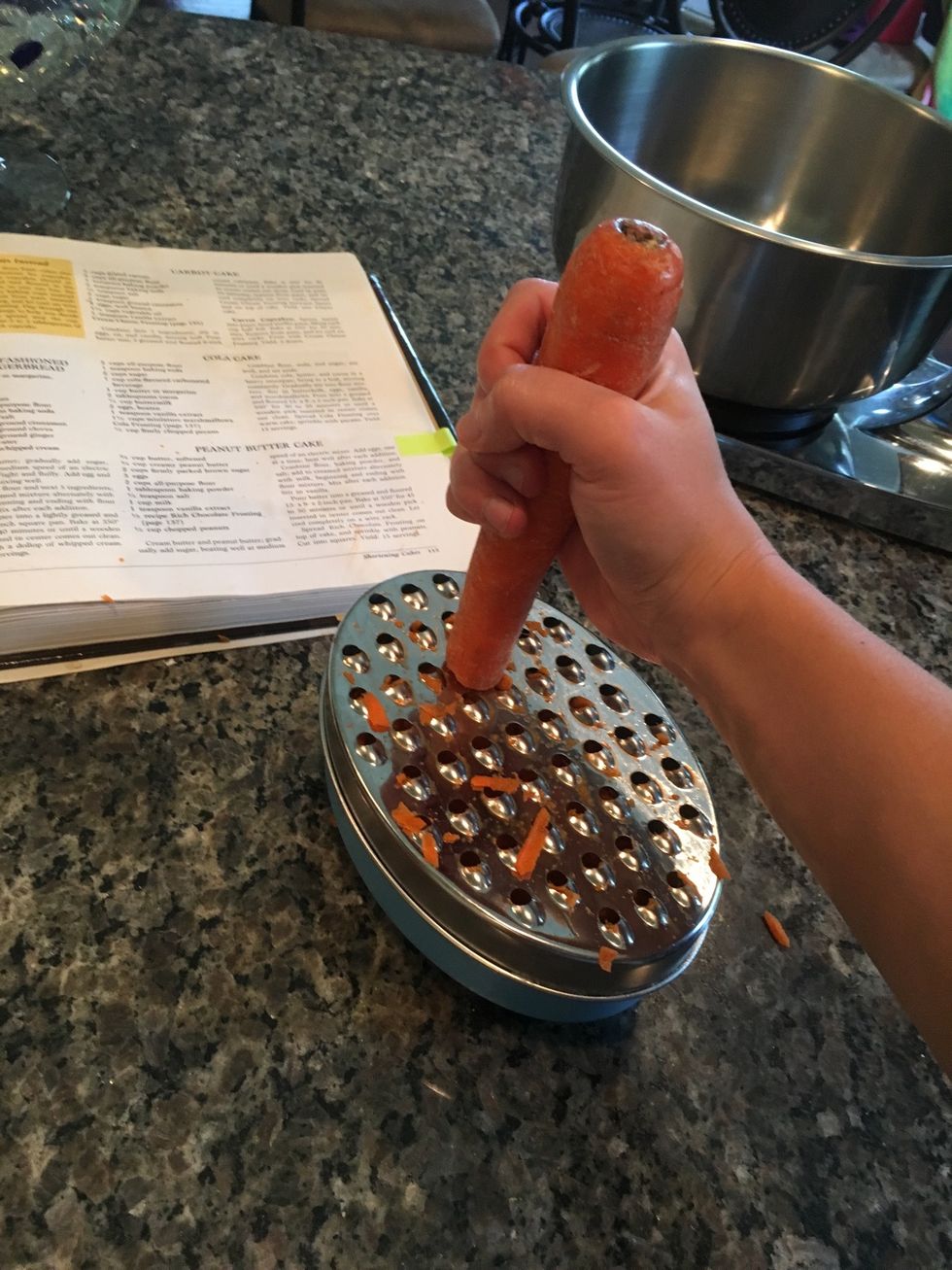 Then, grate the carrots.