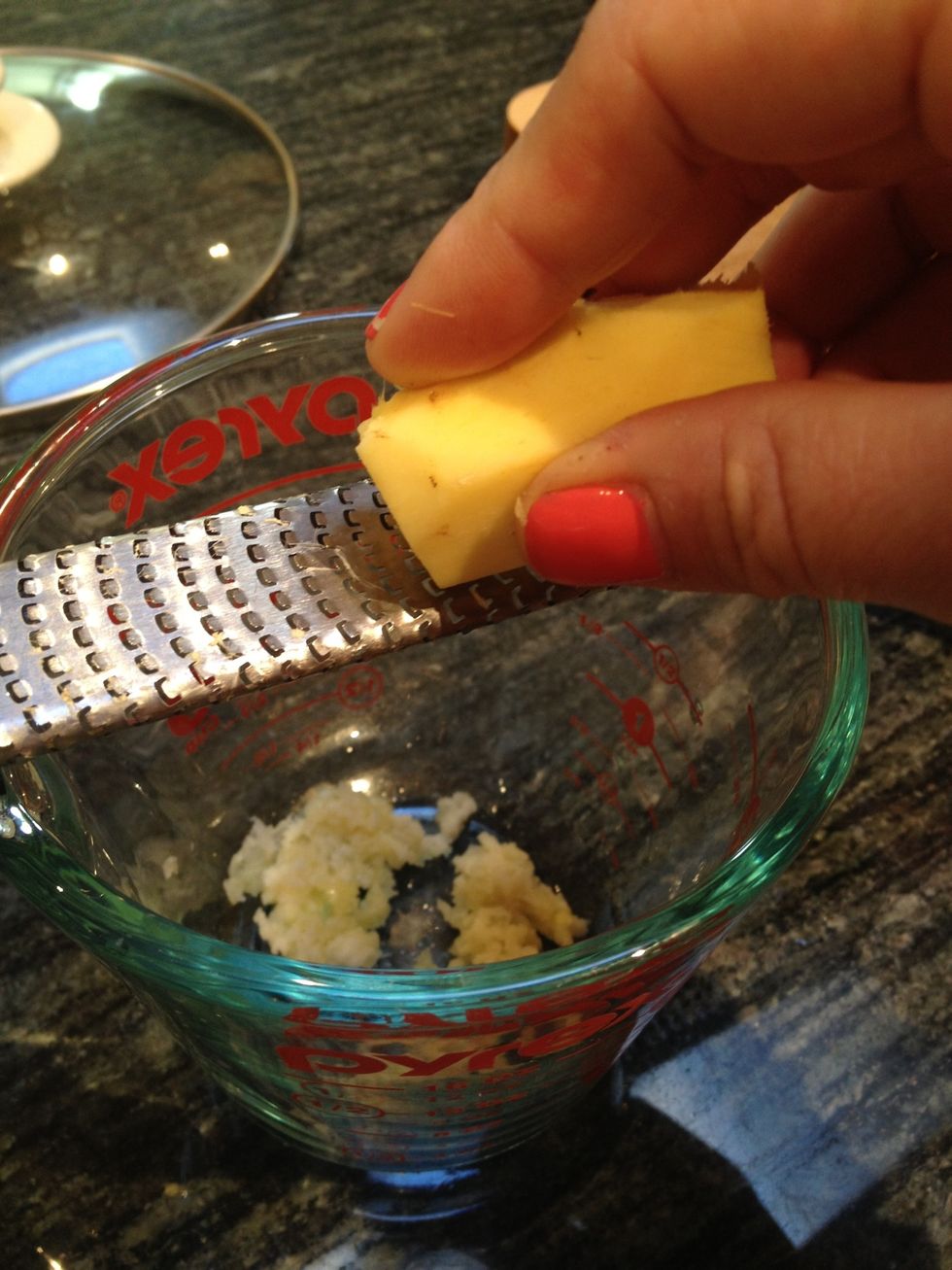 Then, grate the ginger.