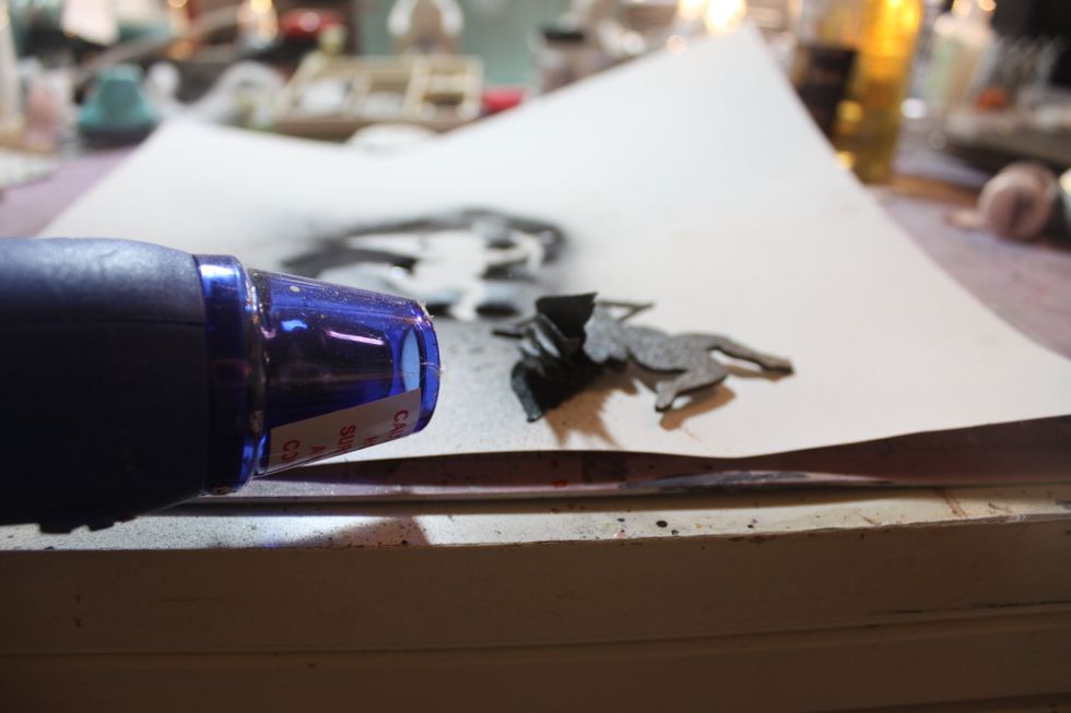 Then, hit her with the embossing gun again to dry.