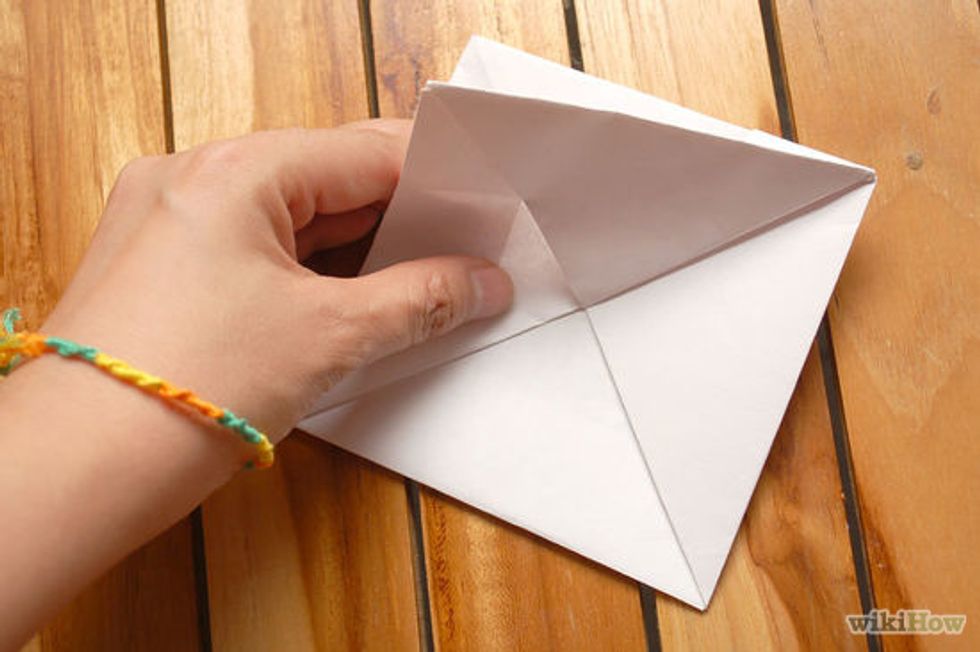 Then hold one side up and do the same on the back.