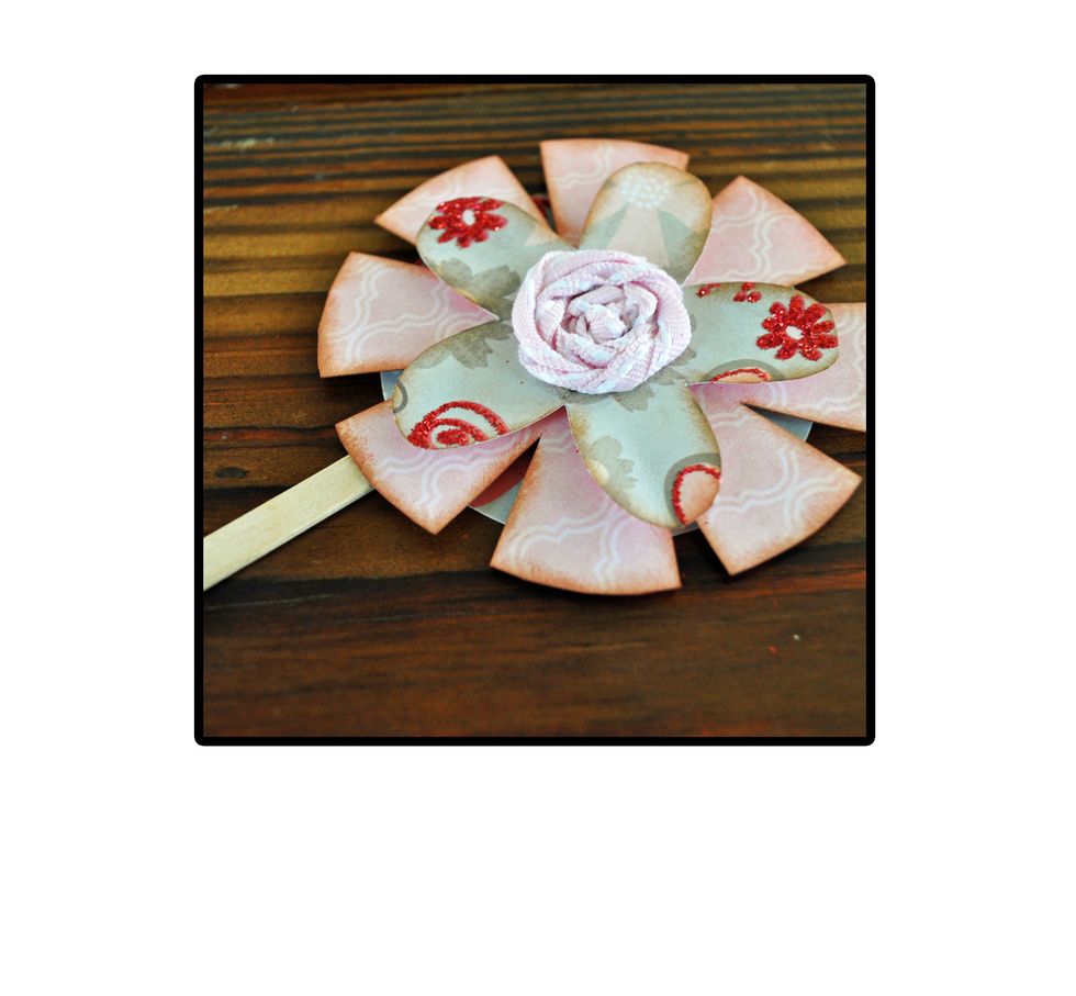 Then hot glue your layered flower on top of that. Note: I add the hot glue to the stick and then press the flower down on top.