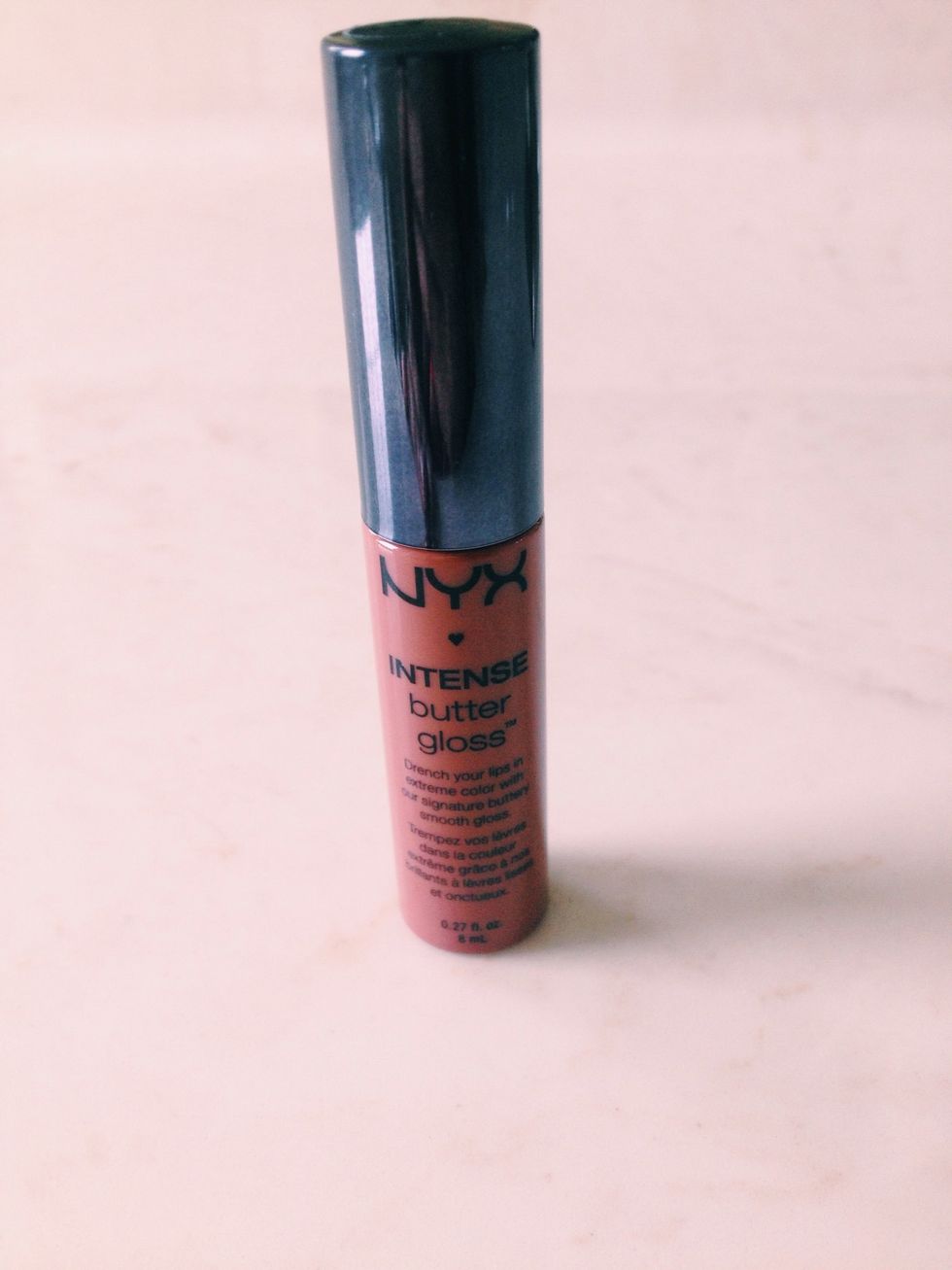 then i applied this intense butter gloss in the color chocolate crepe it's so pretty it's definitely a good dupe for the urban decay new revolution glosses