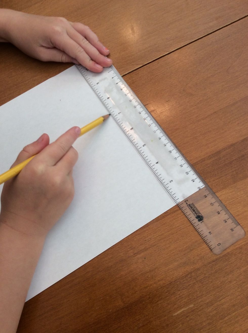 Then I line a ruler up with the top of my paper and draw a line.