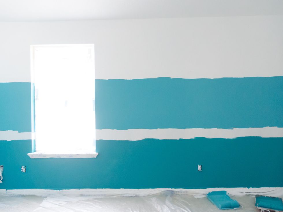 Then, I painted the Glidden Premium Paint+Primer in Deep Pool on the bottom section that I marked on the wall.