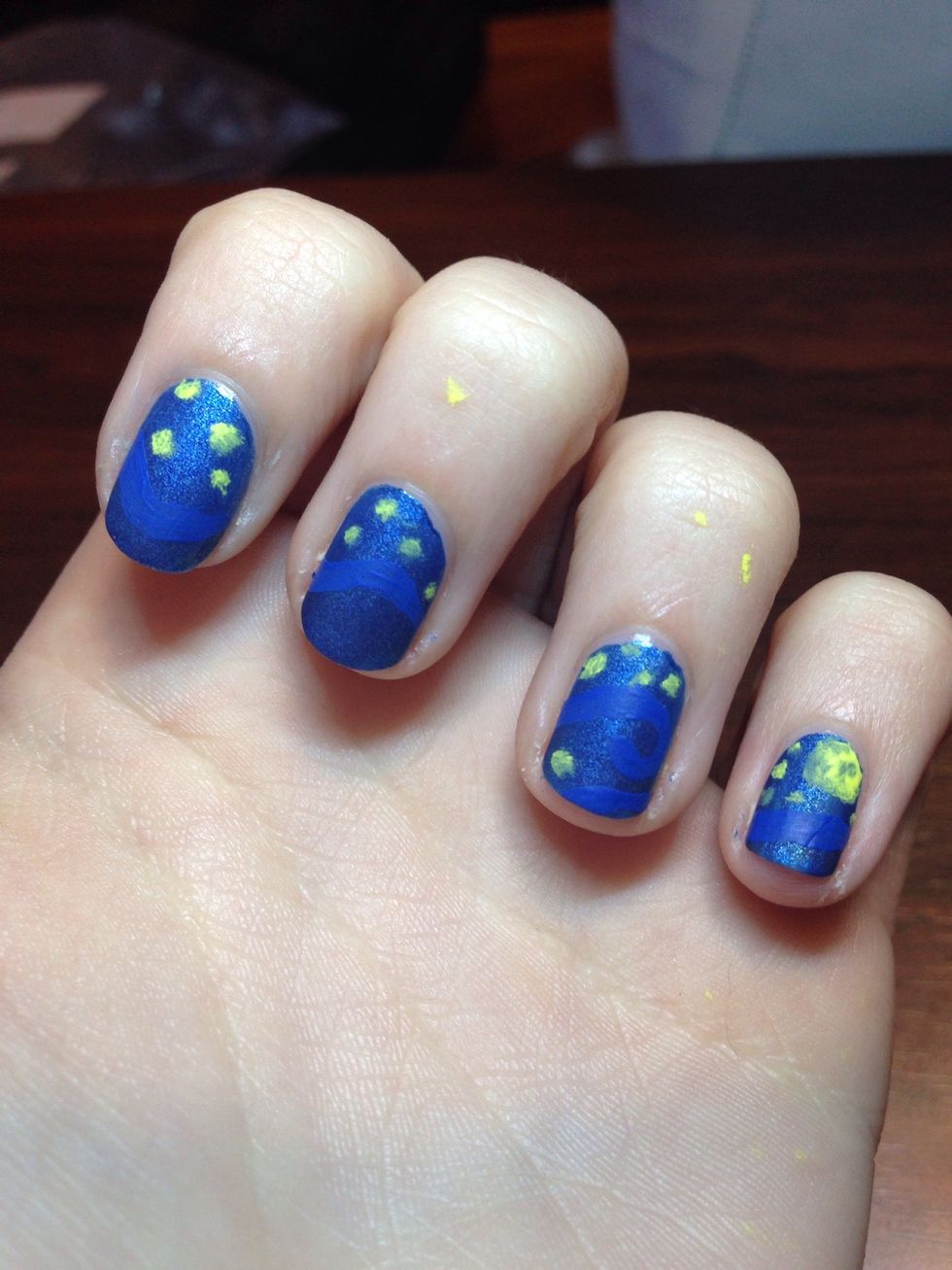 Then I put yellow dots for the stars (one large one on my pinky for the moon) using a stippling motion, to make it look less like a definite dot