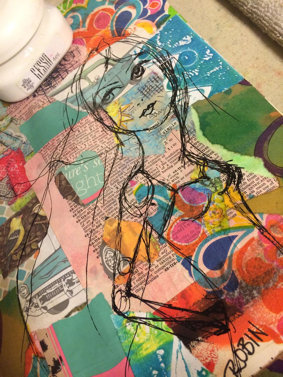 Then, I sketched a girl out onto my page with a permanent black pen. There are pros and cons for using a permanent pen. Pro-it won't bleed when you put any wet media on it. Con....