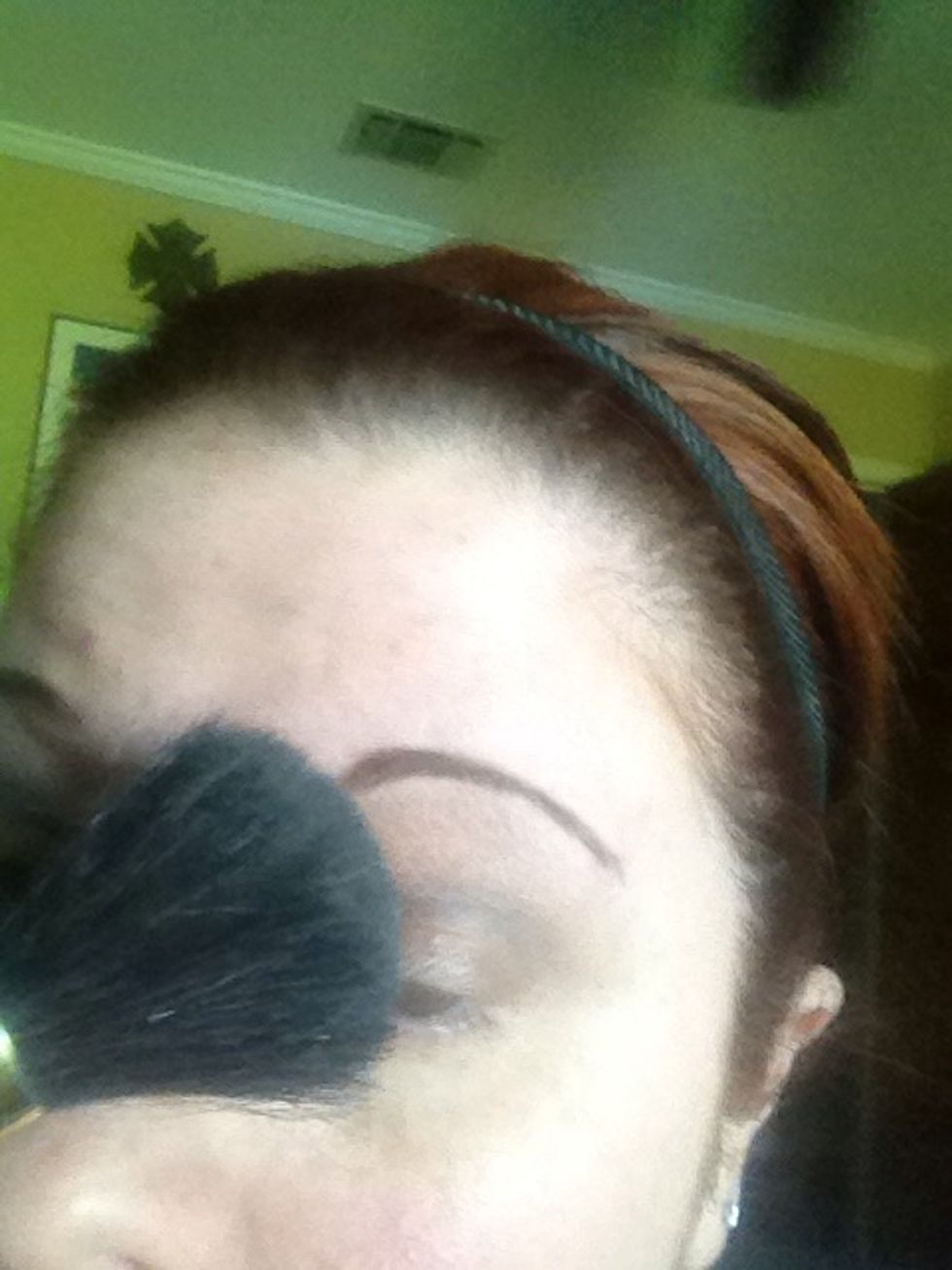 Then I take a large brush and make one sweep over the eye to blend a little more