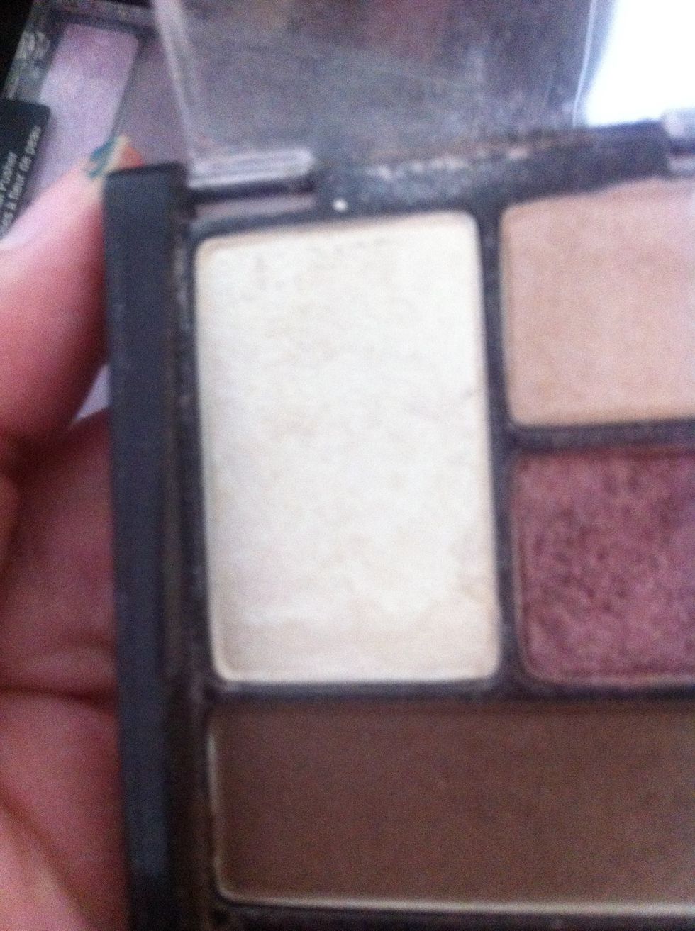 Then I use a creamy white color and lightly apply on the eye lid. And blend it (: