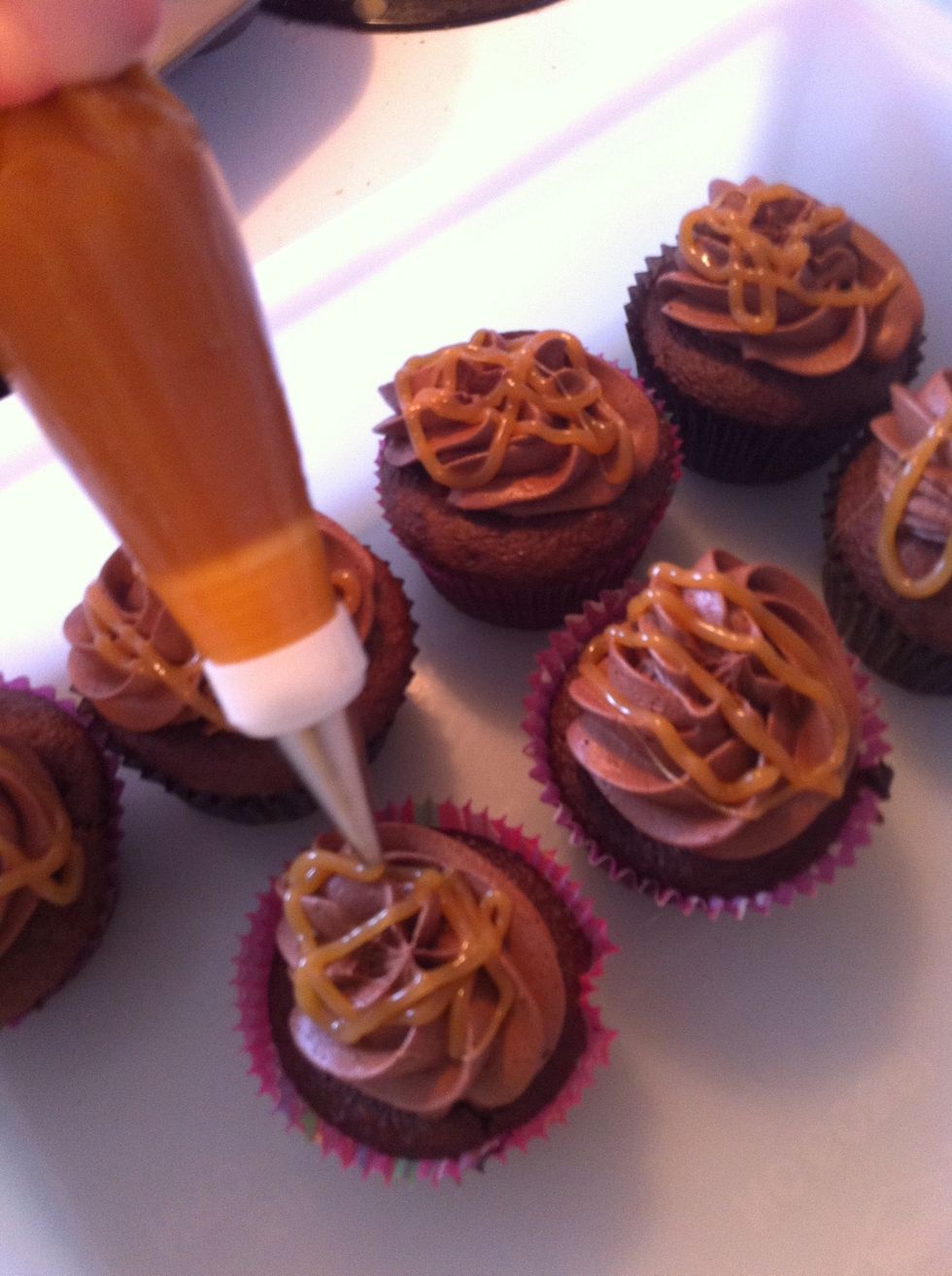Then I used a smaller, circular tip (#5) to pipe the caramel sauce on top of the icing. You can also use caramel sundae topping-it's less messy!