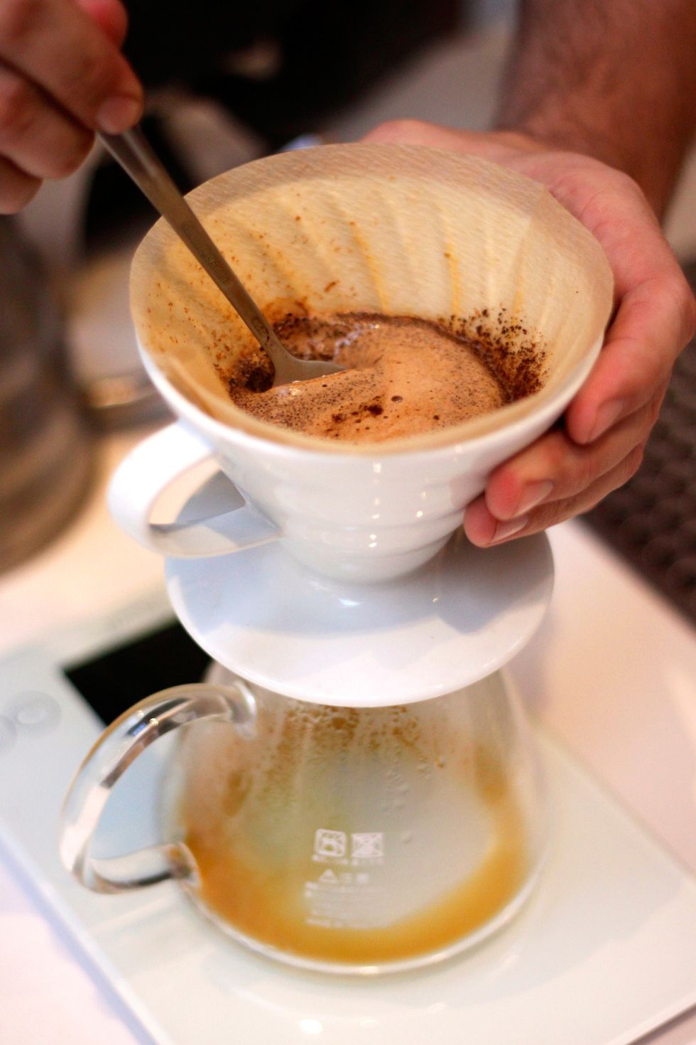 Then immediately take a spoon and stir everything up. Get down deep. You want to make sure everything is wet for an even brew.