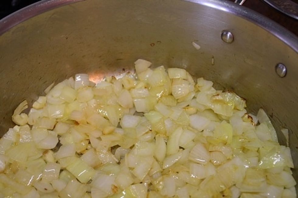 Then in another pan, saut\u00e9 the finely chopped onions and garlic (optional) in butter.