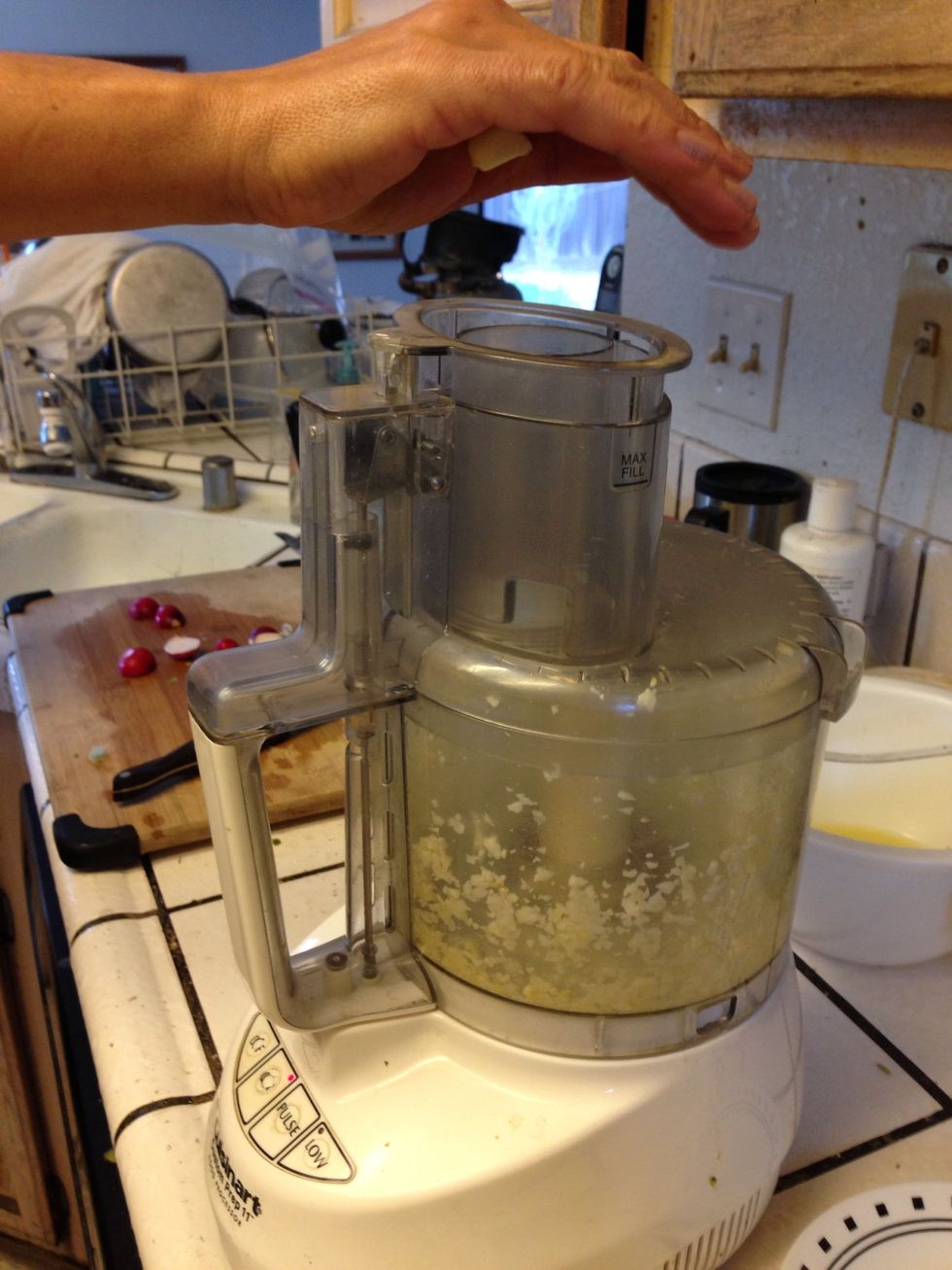 Then in good processor grate the garlic