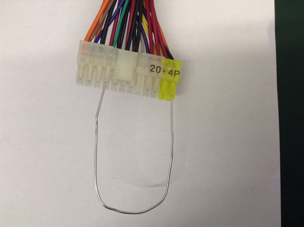 Then insert the other end of the paper clip into the bottom of the plug beneath the GREEN wire.