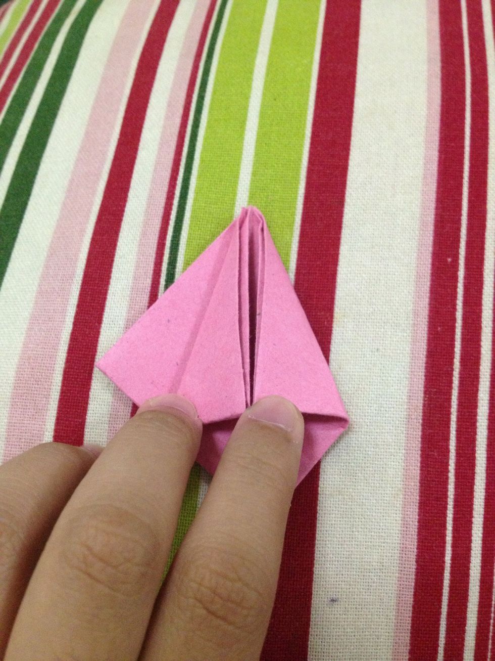 Then, insert the right flap inside the left pocket as far as it goes.