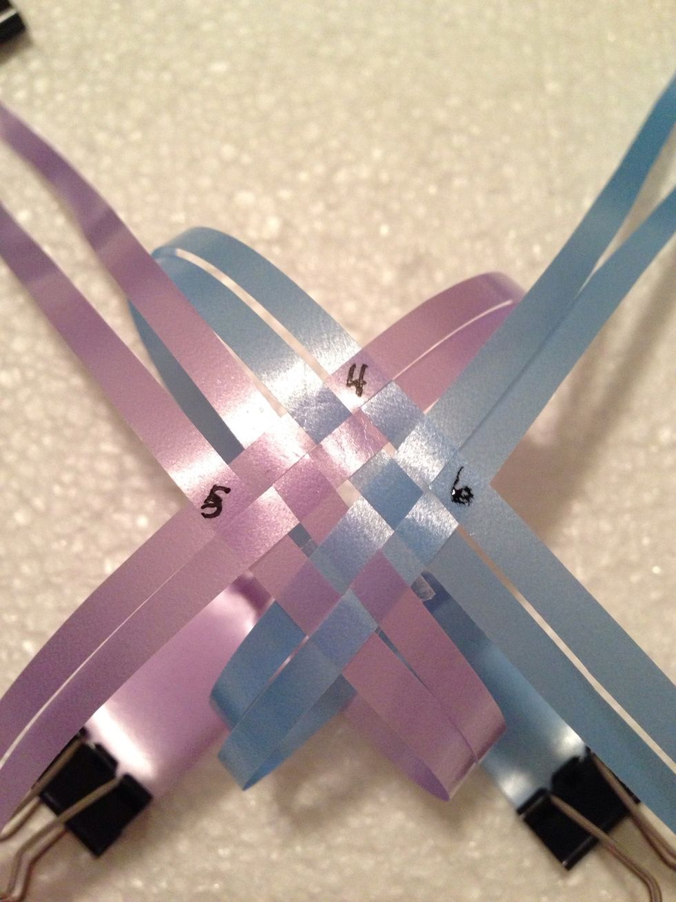 Then interlace the 4 strips on both sides shown in 5&6.