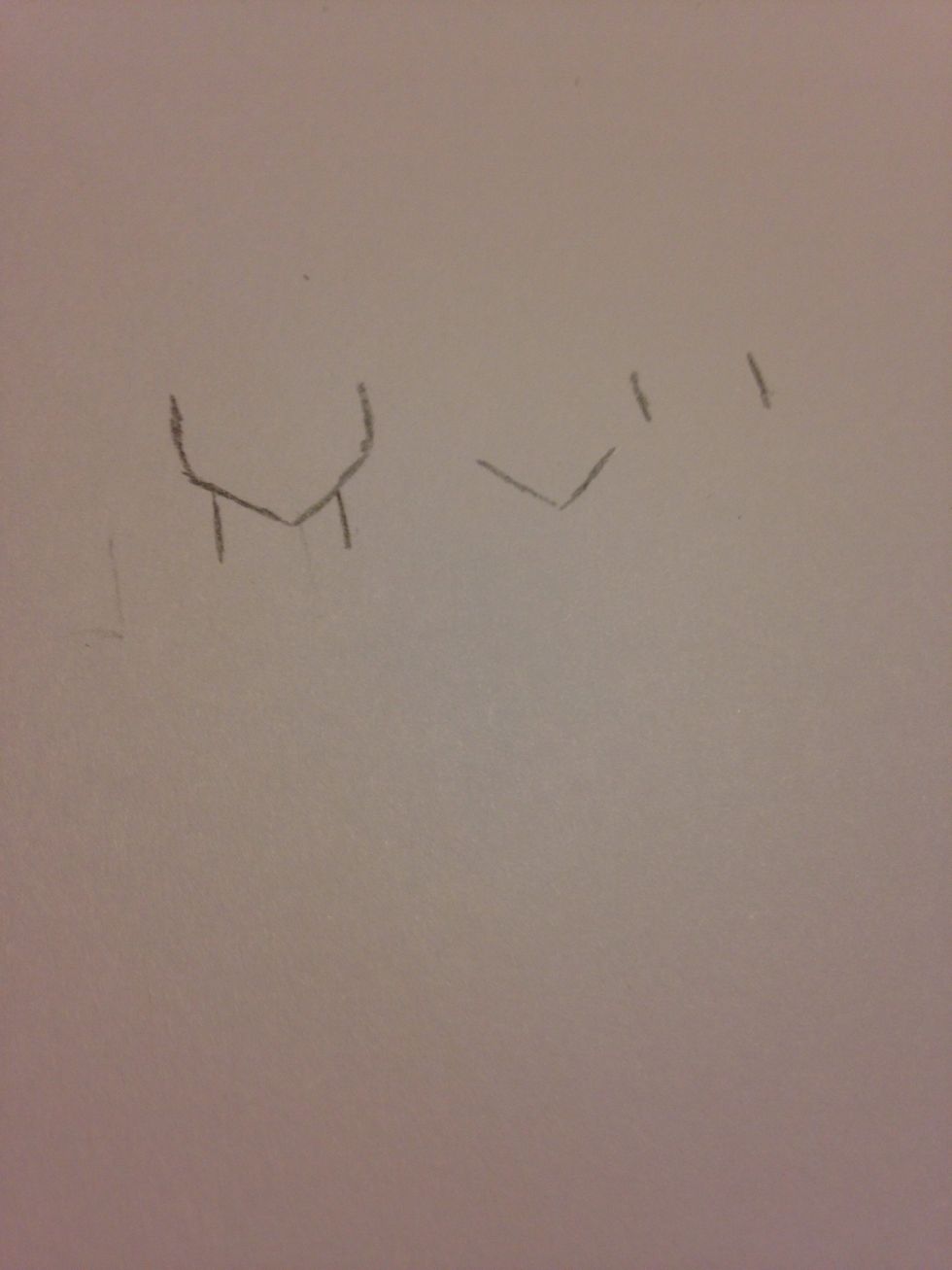 Then just carry on with the head, I demonstrated how I created mine with a simple " v " shape and two lines