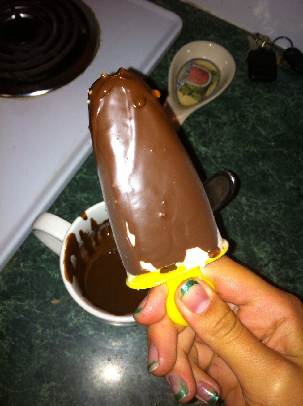 Then, just dip the Popsicle into the chocolate goodness and voila! Coconut oil melts at 76F, so when it hits a frozen popsicle, it hardens immediately