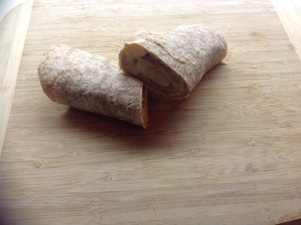 Then just gently roll up your tortilla and slice it in half for easy eating!