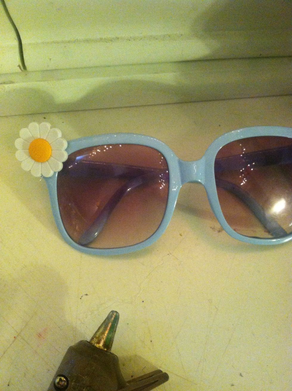 Then just start putting a drop of glue on the back of the back of the flower and place it were you want it