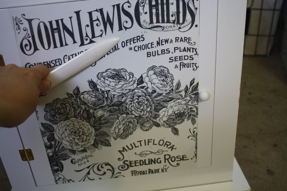 Then, just to be sure all the spots have good contact, I use a bone folder on the scripted areas that are smaller, and on the flowers.