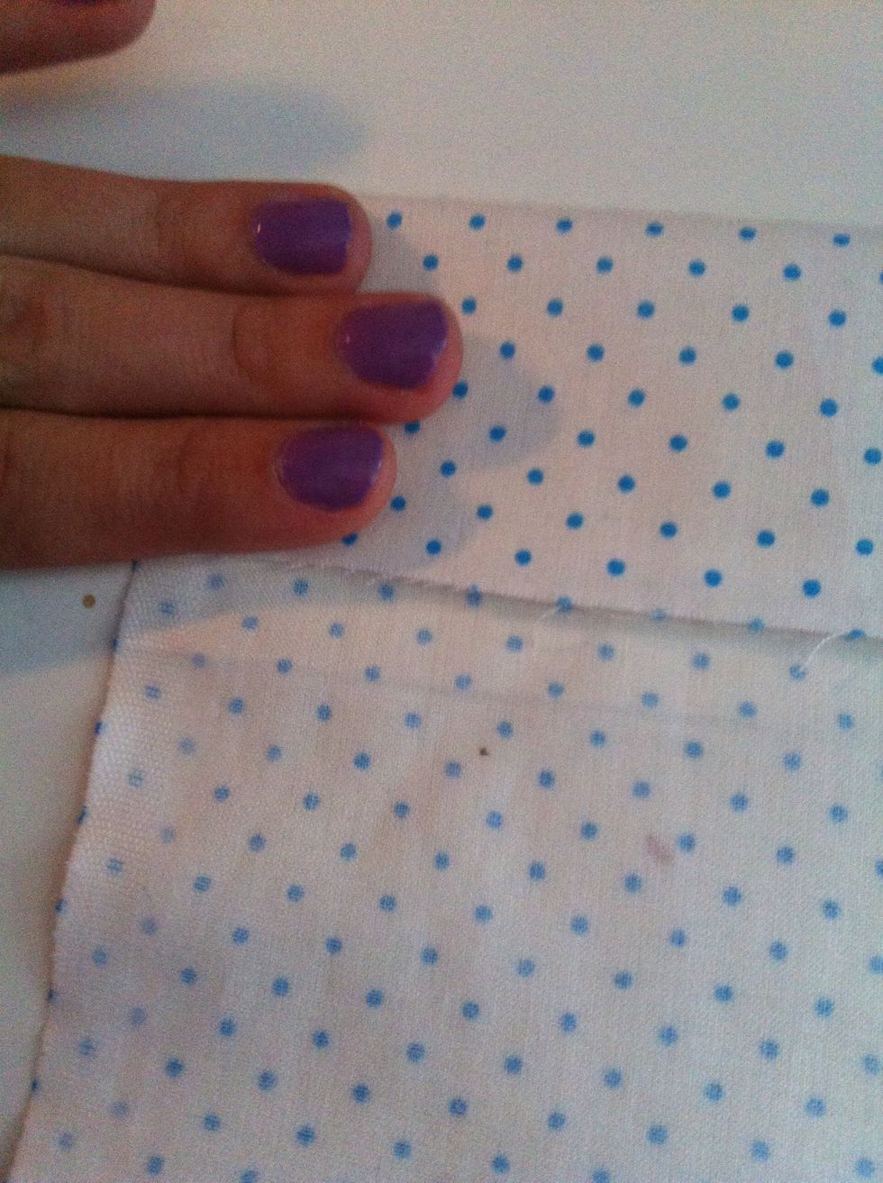 Then lay it out flat and fold it over how ever much you want the width of your bow to be I did 3 finger length
