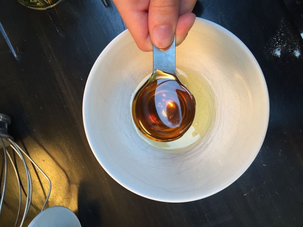 Then lightly beat the egg and golden syrup together in a separate bowl. Put the spoon in hot water before measuring out the golden syrup to make it easier to pour.