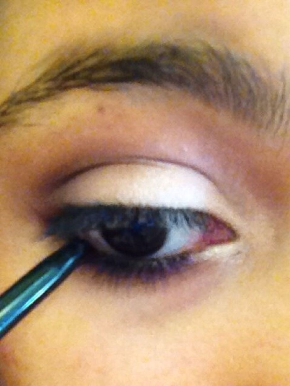 Then line your eyes with a black liner