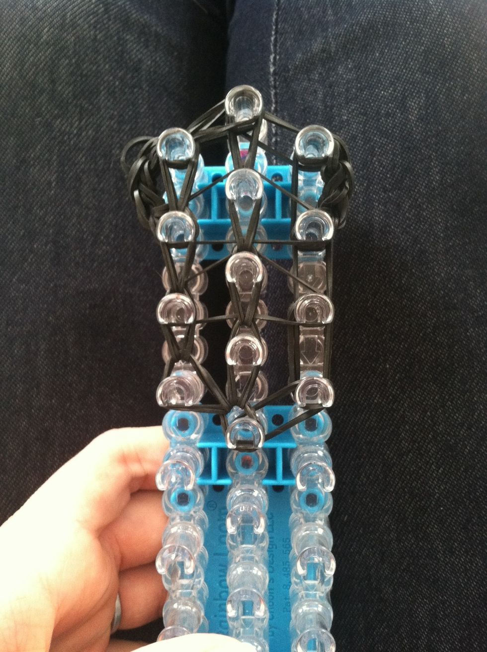 Then loop from the middle the next two bands should be to the left. Loop It up. When you get to the ears, it might be hard to find the bottom band because it's so full.