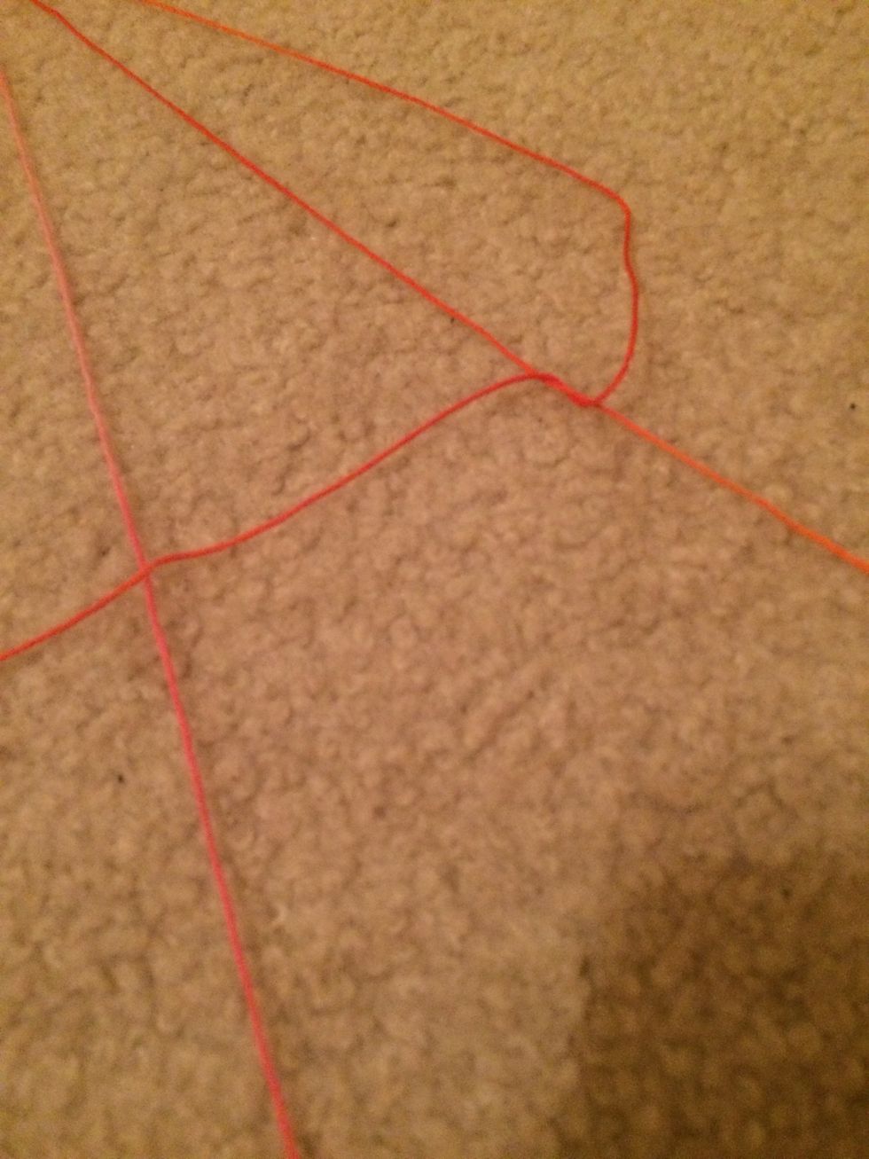 Then loop it through and tighten it. You need to do this step twice on each string. Complete the same steps on the opposite side