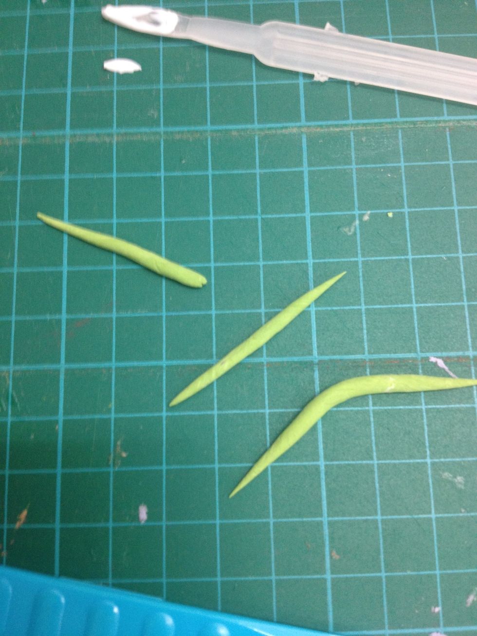 - Then, make 3 flower sepals with the green clay.