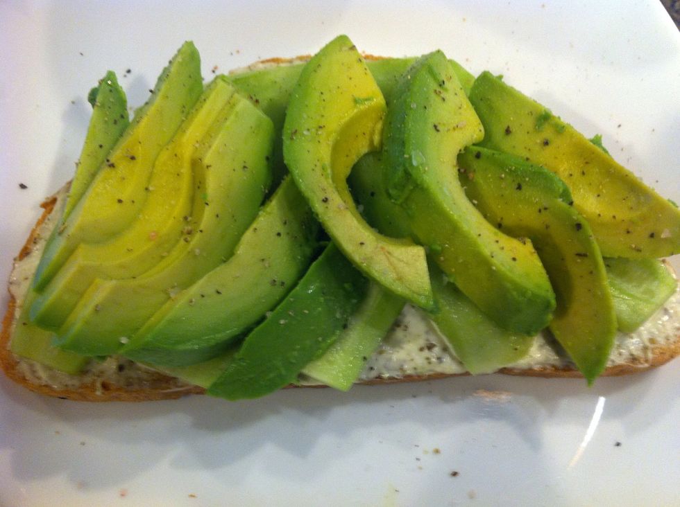 Then make a layer of avocado slices. Season it with salt + pepper.