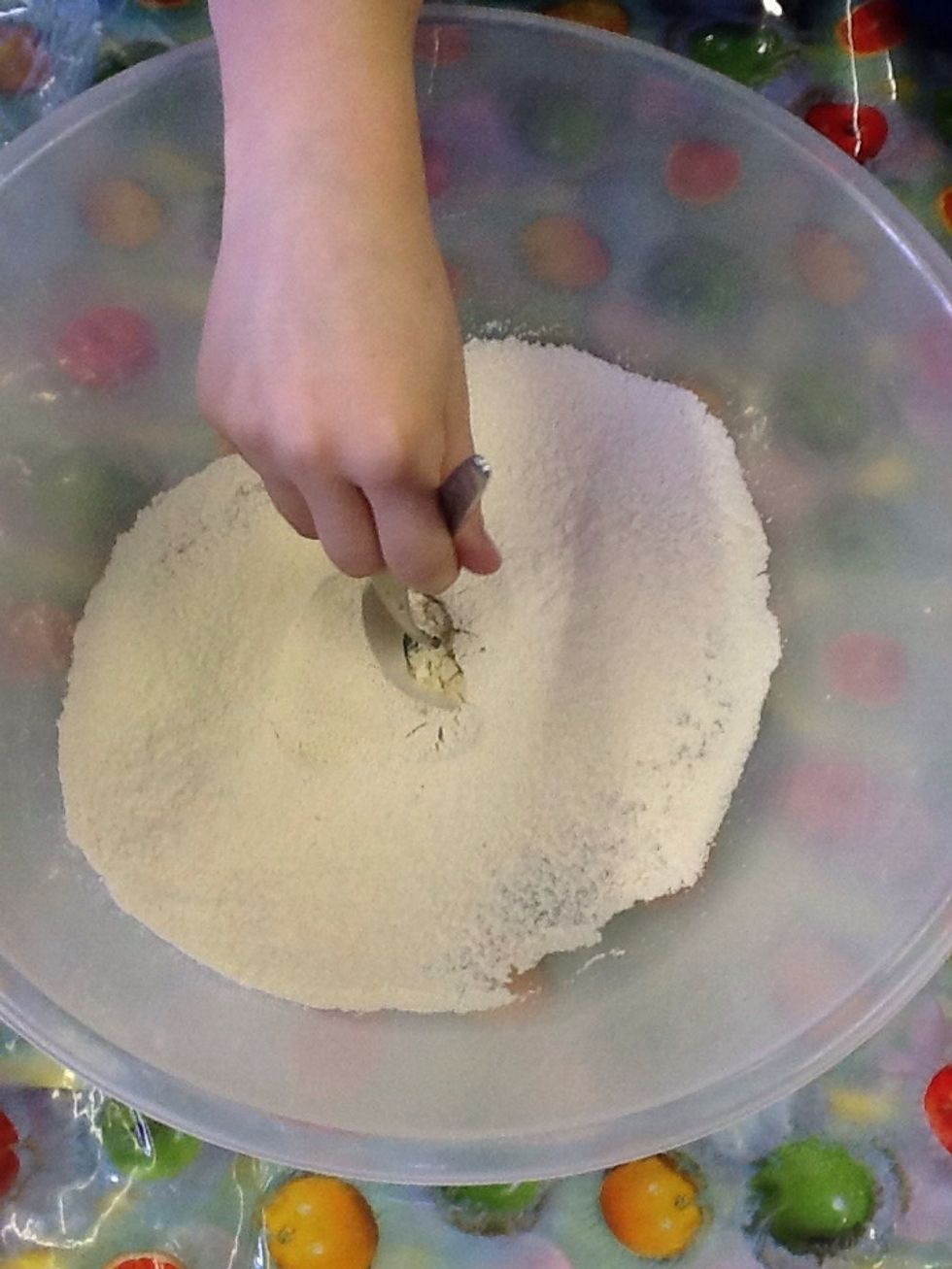 Then make a midiem size hole in to bottom of the flour.