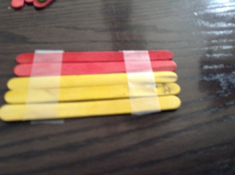 Then make walls with 5 Popsicle sticks