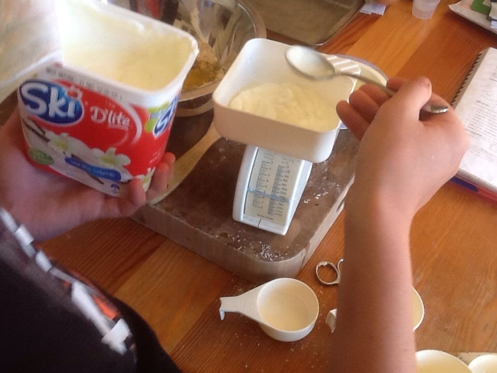 Then measure out 200g of plain yoghurt then pour it into the bowl.