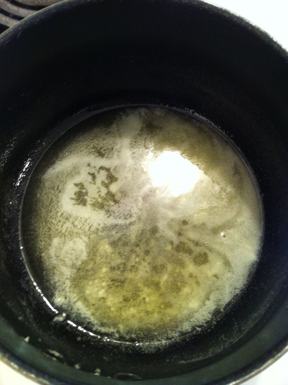 Then mix in icing sugar. Swirl or stir the mixture until the sugar is dissolved. Then add the oil.