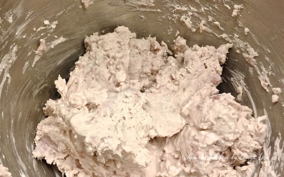 Then mix in salt, oil and hot water. Add the water a little at a time and mix till the dough comes together.