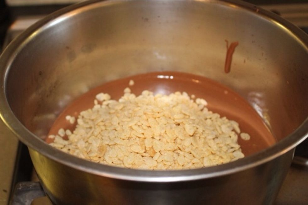 Then, mix in the Rice Krispies.
