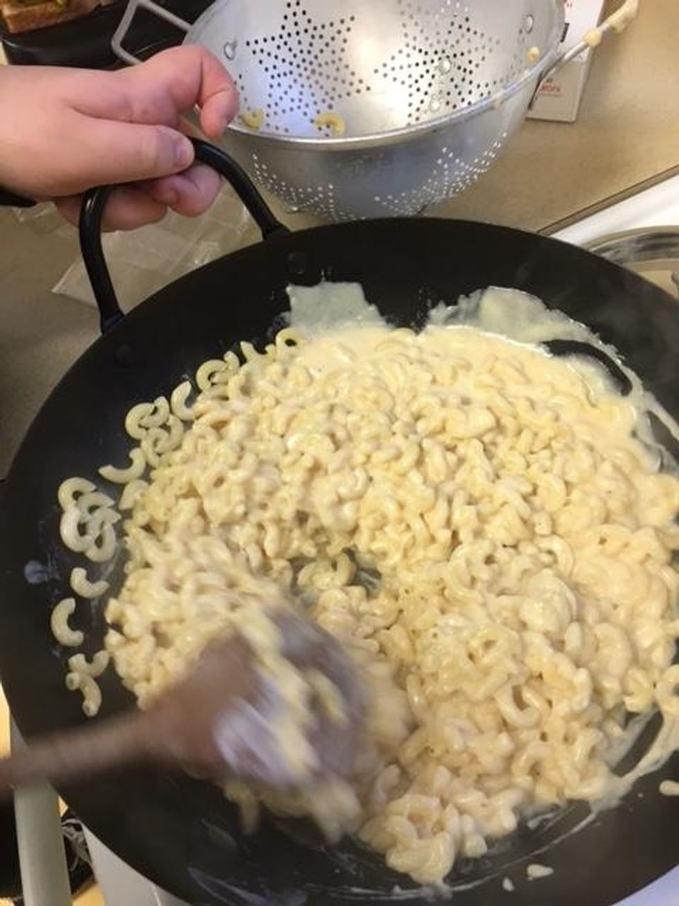 Then mix the noodles and cheese sauce together.