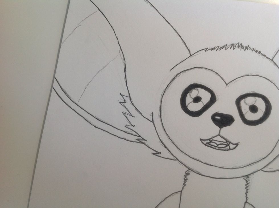 Then Momo should look like this. Then fill in the nose whit the black pencil.