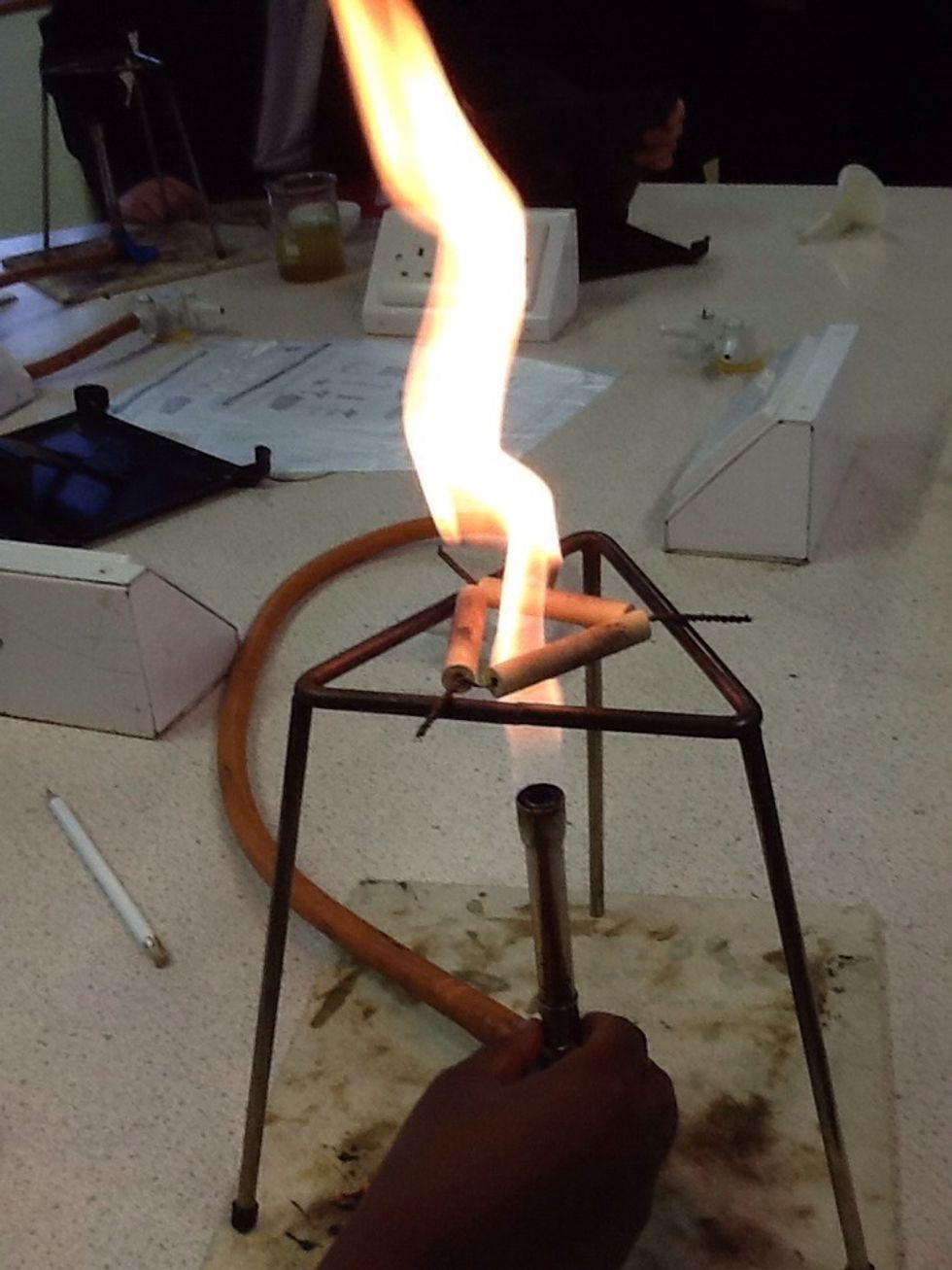 Then move the gas burner... Pulling the orange lead to the side of the pipestem...