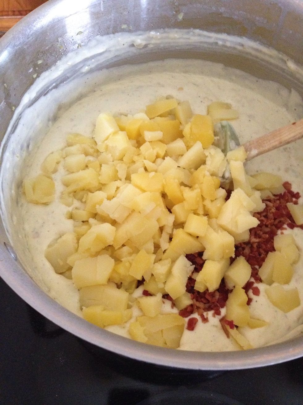 Then my diced potatoes. This will be very thick at this point. Thats ok.. Now you're ready for chicken broth. I start with about 5 cups