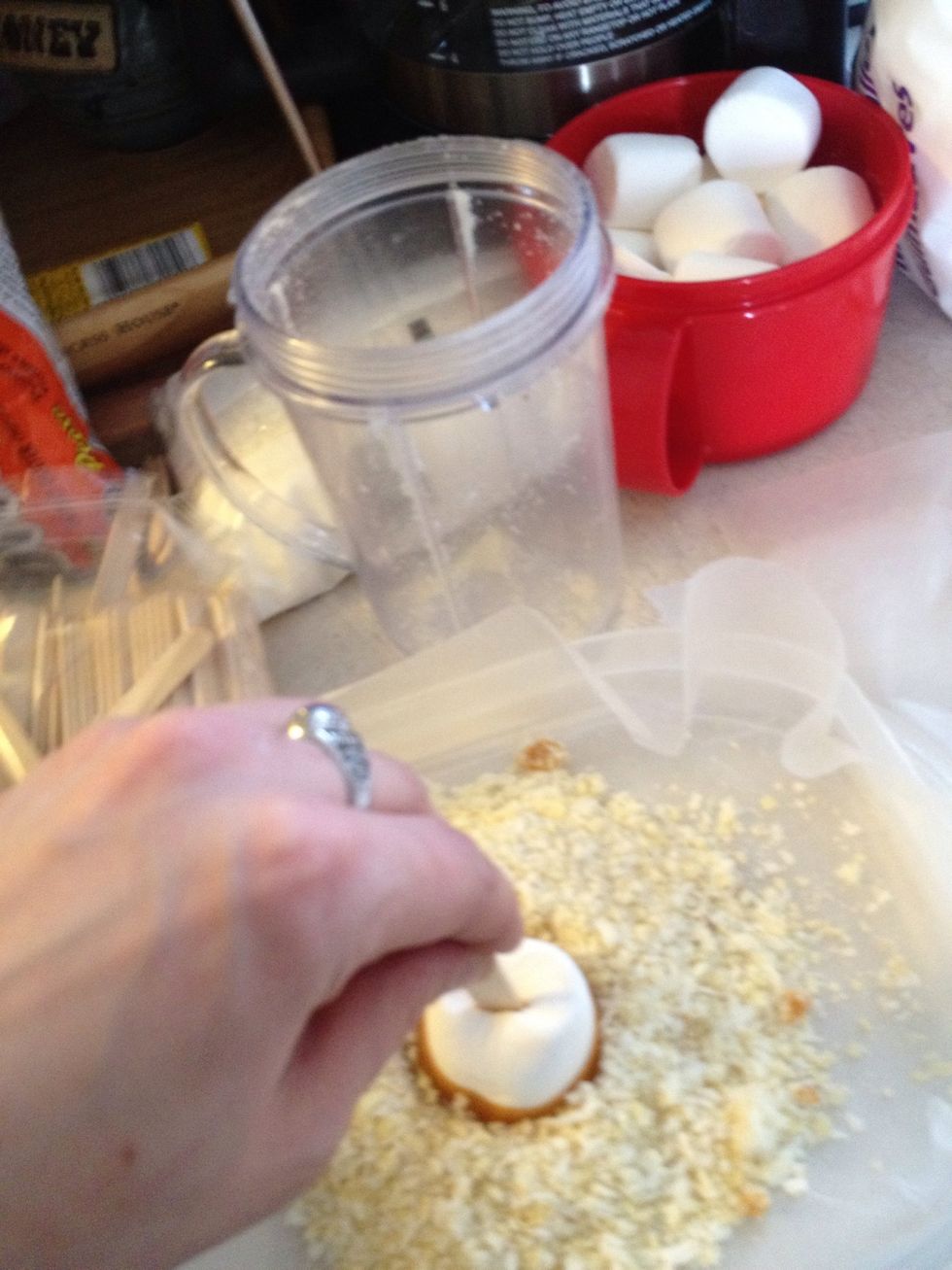Then next coat the bottoms in the dry mix evenly coating it and a little on the sides. I put parchment paper under so when the dry mix starts to disburse around the dish it's easy to collect it again.