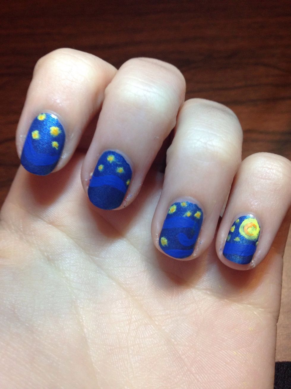 Then on the large yellow spot I add a orange moon. Then small orange dots on the smaller yellow circles for stars (also stippled)