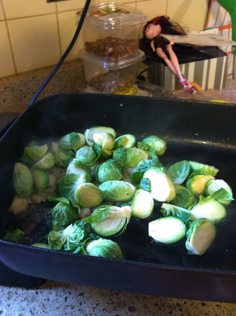 Then once your onions are brown, add your sprouts for 30 seconds with the onions without the water yet.